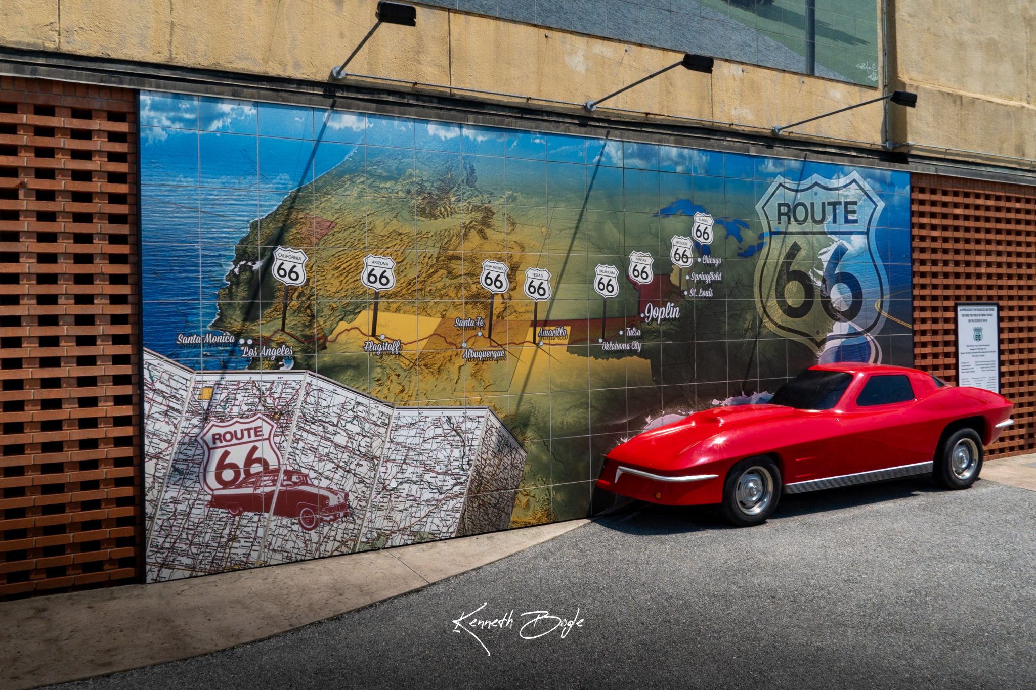 Route 66 mural tile map with a red Corvette